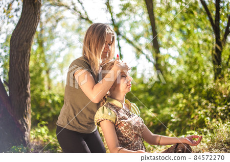 Master massage therapist adequately performs a great massage in nature. Master massage therapist adequately performs a great massage in nature. 84572270