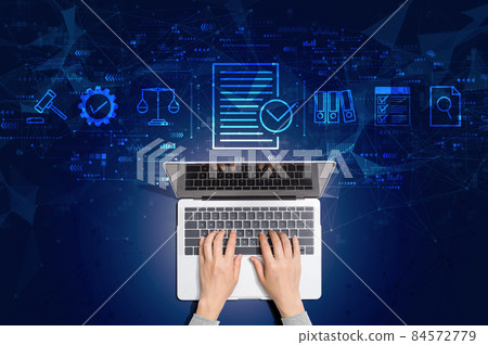 Compliance concept with person using laptop 84572779