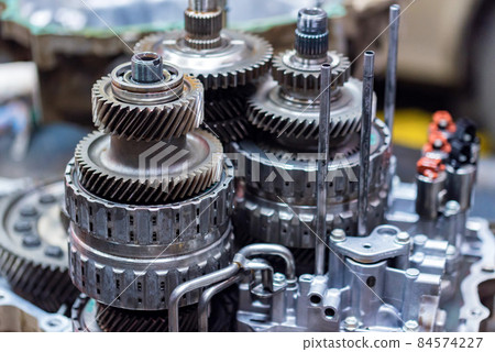 Close-up helical gears in car automatic transmission 84574227
