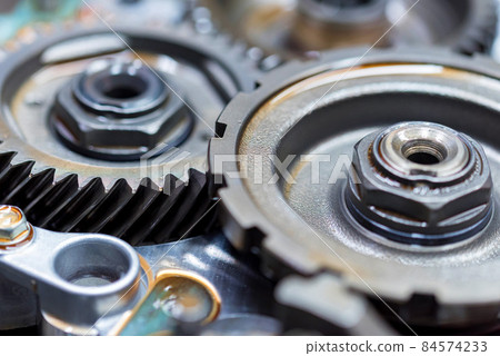 Close-up helical gears in car automatic transmission 84574233