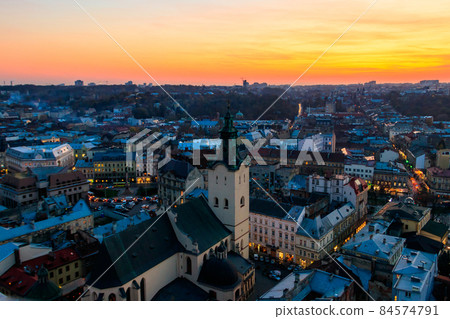 Aerial view of Latin cathedral and Rynok square in Lviv, Ukraine at sunset. View from Lviv town hall 84574791