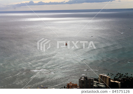 The horizon on the Ocean with a boat floating and the vortex 84575126