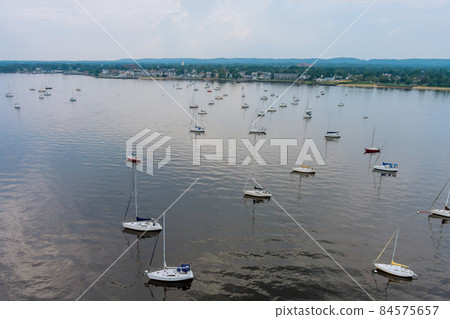 Aerial top view of many fishing boats yachts near marina 84575657