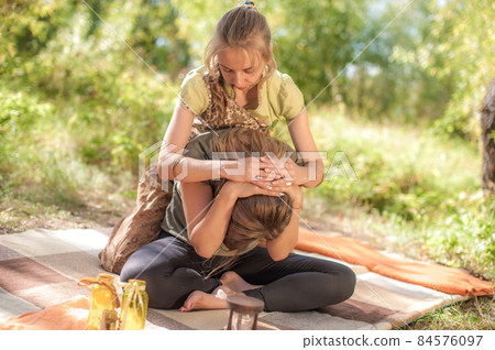 Healer adequately performs a great massage on the forest floor. 84576097