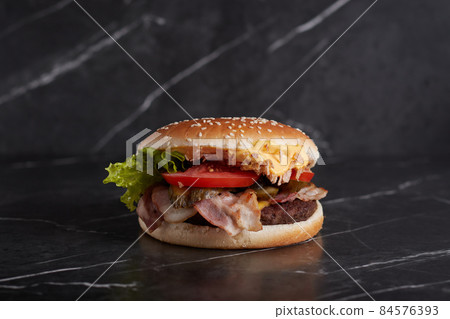 burger with meat and cheese on the table, american cuisine, close-up, tomato, dark background, marble, burger with meat and cheese on the table, american cuisine, close-up, tomato, dark background, marble, 84576393