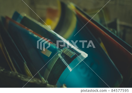 Used photopolymer printing plate in ink. Box with used printing plates. Printing house. Selective focus Used photopolymer printing plate in ink. Box with used printing plates. Printing house. Selective focus 84577595