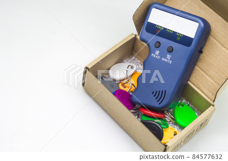 Magnetic key programmer. Duplicator for intercom keys. Electronic equipment for small businesses. Selective focus, copy space Magnetic key programmer. Duplicator for intercom keys. Electronic equipment for small businesses. Selective focus, copy space 84577632