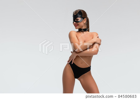 Sexy topless woman in black mask Sexy topless woman in black mask 84580683