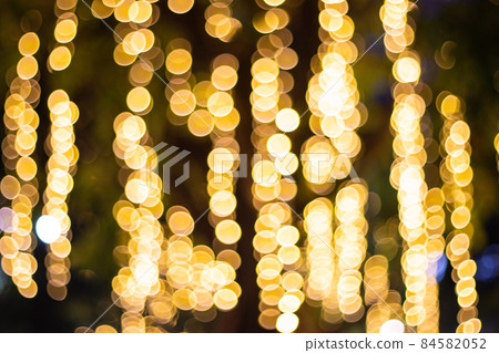 Decorative outdoor string lights hanging on tree in the garden at night time Decorative outdoor string lights hanging on tree in the garden at night time 84582052