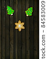 Homemade Christmas cookies on fark wooden table. 84583009