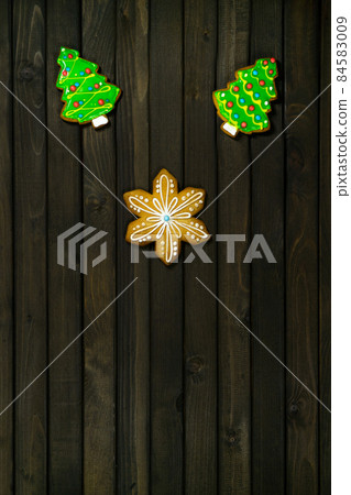 Homemade Christmas cookies on fark wooden table. 84583009