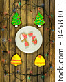 Homemade festive cookies on wooden table. 84583011