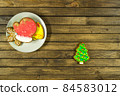 Homemade Christmas cookies on wooden table. 84583012