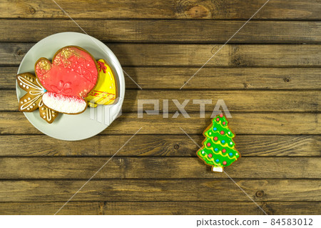 Homemade Christmas cookies on wooden table. 84583012