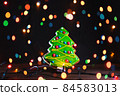 Gingerbread cookie on colorful background. 84583013