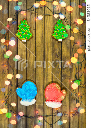 Homemade festive cookies on wooden table. 84583015