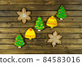 Homemade festive cookies on wooden table. 84583016