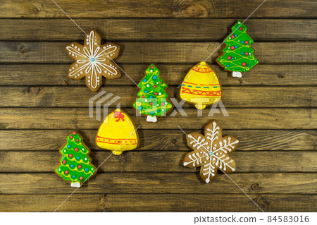 Homemade festive cookies on wooden table. Homemade festive cookies on wooden table. 84583016