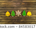 Homemade festive cookies on wooden table. 84583017