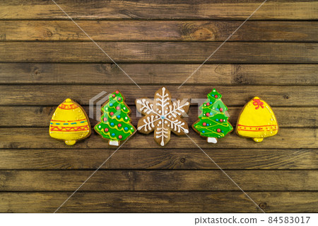 Homemade festive cookies on wooden table. Homemade festive cookies on wooden table. 84583017