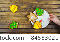 Homemade festive cookies on a wooden table. 84583021