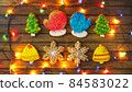 Homemade festive cookies on a wooden table. 84583022