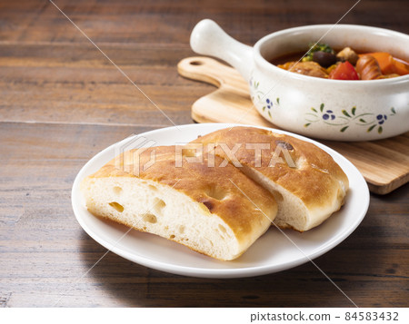 Tomato stew and focaccia Tomato stew and focaccia 84583432