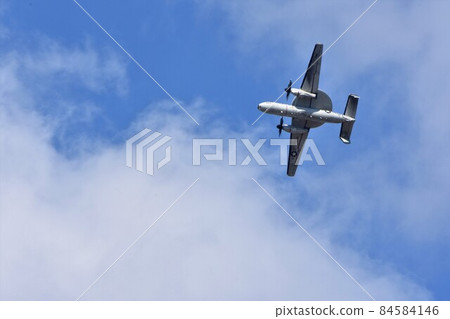 U.S. Navy E-2C warning and control aircraft flying in the sky 84584146