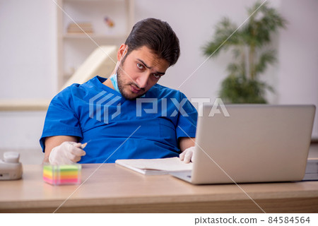 Young male doctor in vaccination concept Young male doctor in vaccination concept 84584564
