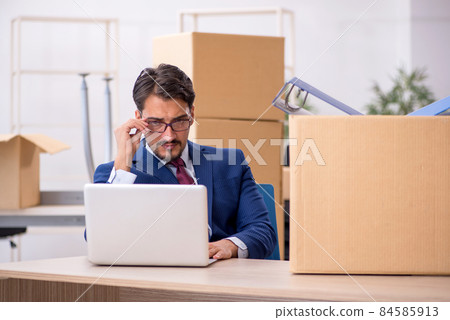Young male employee in relocation concept Young male employee in relocation concept 84585913