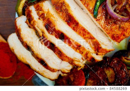 roasted grilled BBQ chicken breast with herbs and spices roasted grilled BBQ chicken breast with herbs and spices 84588269