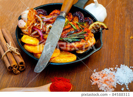 roasted grilled BBQ chicken breast with herbs and spices 84588311