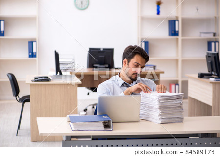 Young male employee working in the office 84589173