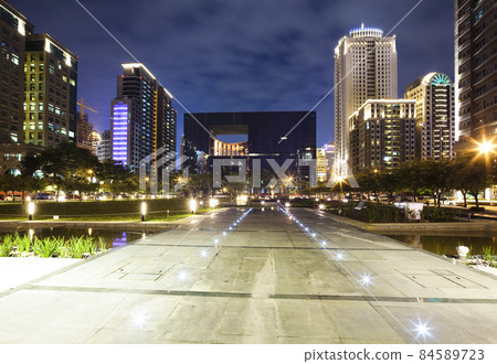 Night view of the square and surrounding modern buildings view in front of Taichung City Hall, Taiwan. It is the highest-level local administrative agency in Taichung. 84589723
