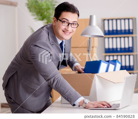 Businessman moving offices after promotion Businessman moving offices after promotion 84590828