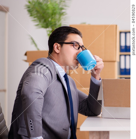 Young handsome businessman moving offices 84590829