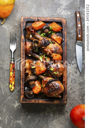Chicken legs in soy sauce with pumpkin 84591052