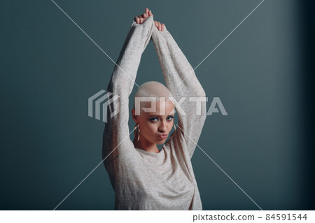 Millenial young woman with short blonde hair portrait. 84591544