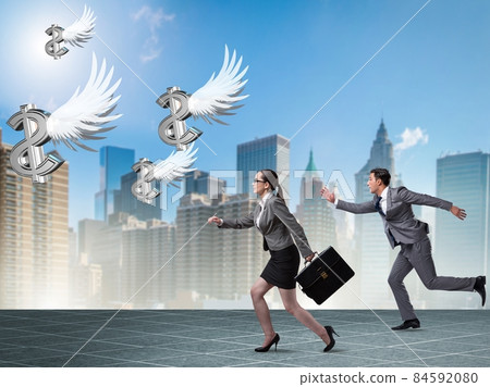 Businesspeople chasing angel investor funding Businesspeople chasing angel investor funding 84592080