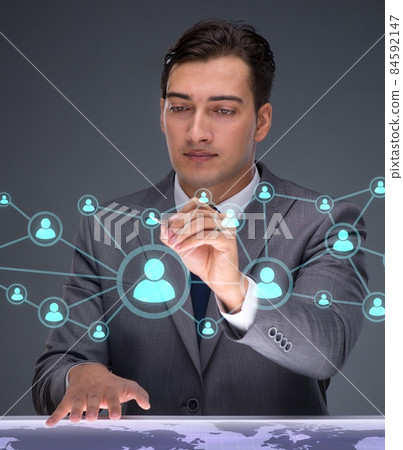 Businessman in social networks concept Businessman in social networks concept 84592147