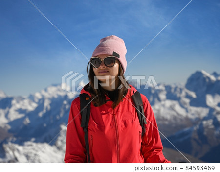Portrait of a young woman on the background of Elbrus mountains in Russia Portrait of a young woman on the background of Elbrus mountains in Russia 84593469