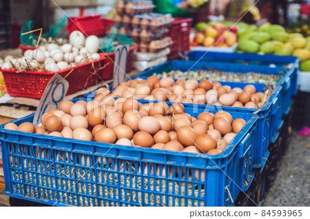 The eggs - chicken and quail in the wicker basket on the Vietnamese market. Asian food concept The eggs - chicken and quail in the wicker basket on the Vietnamese market. Asian food concept 84593965