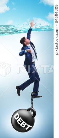 Businessman drowning in concept of high debt Businessman drowning in concept of high debt 84594309