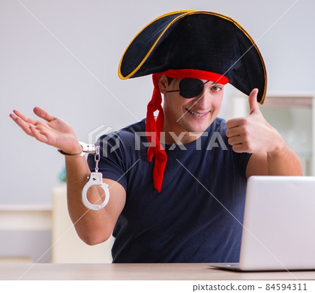 Digital security concept with pirate at computer Digital security concept with pirate at computer 84594311