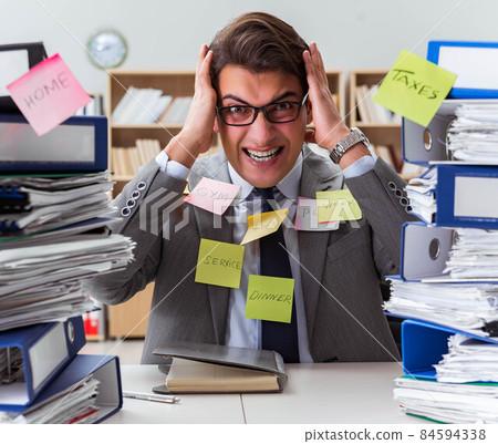 Businessman struggling with multiple priorities 84594338