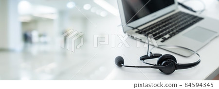 Headset and customer support equipment at call center ready for actively service 84594345