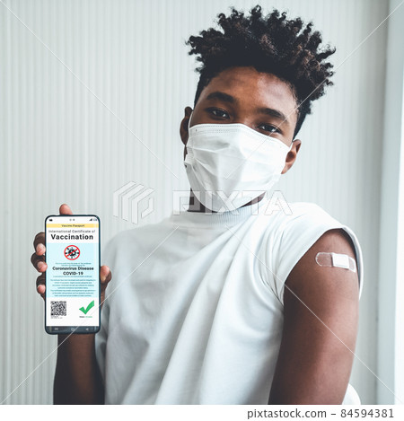 African American teenager shows vaccine passport on mobile phone African American teenager shows vaccine passport on mobile phone 84594381