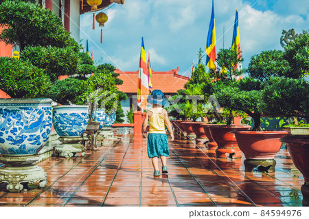 Boy tourist in Buddhist temple in Vietnam Nha Trang Boy tourist in Buddhist temple in Vietnam Nha Trang 84594976