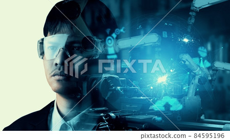 Mechanized industry robot arm and factory worker double exposure 84595196