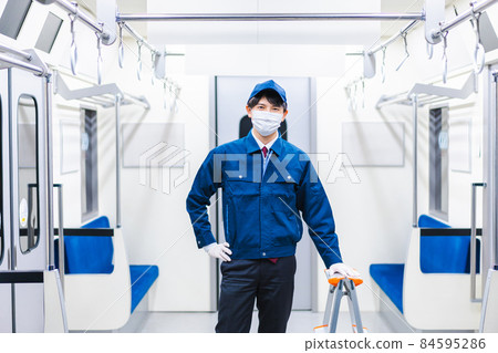 Male technical staff doing train maintenance Male technical staff doing train maintenance 84595286